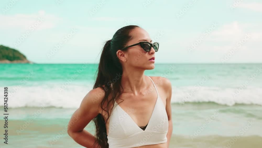 Portrait of a sport fashion Asian woman tan skin in black bikini Portrait of a sport fashion Asian woman tan skin in black bikini