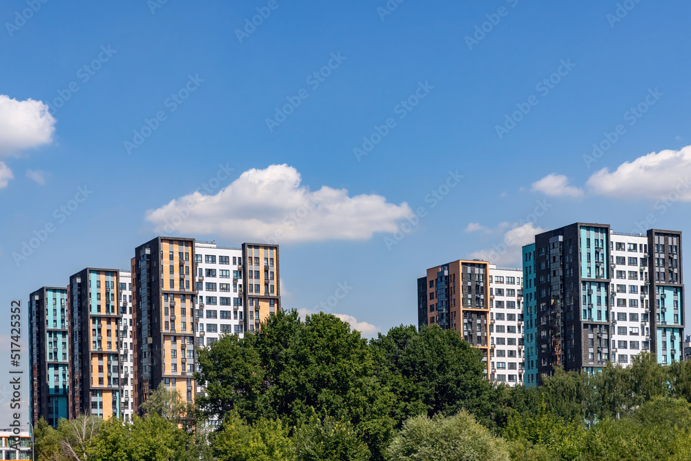 New modern residential apartment buildings district surrounded by green trees park