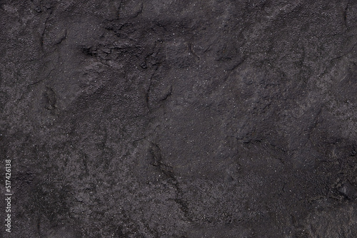 Dark gray background from natural slate. Texture of stone closeup. Graphite background macro © Александр Бутылов