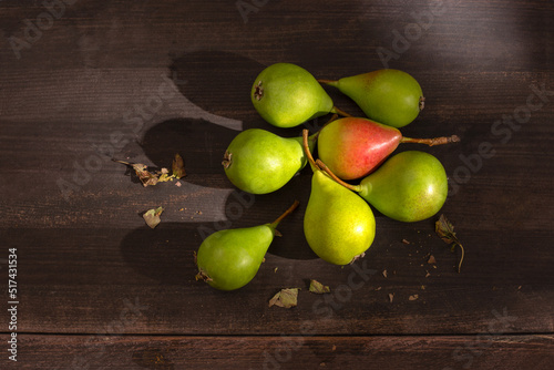 seven fresh pears on wooden table photo