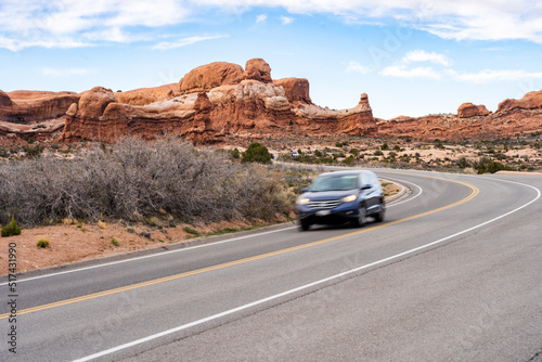 Car Driving on Road in Arches National Park © LeePhotos