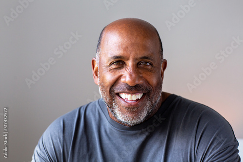 Portrait of a mature man smiling looking the camera.
