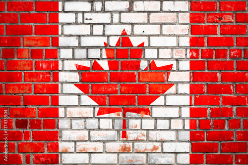 Canadian flag on a grunge brick background.