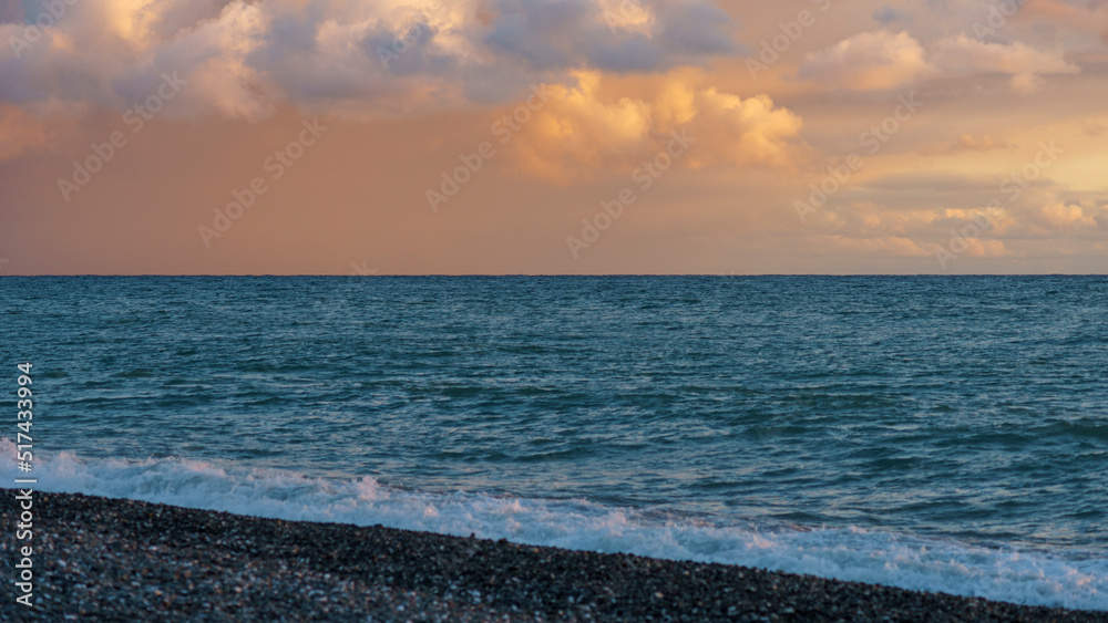 Beautiful gentle pink sunset over the sea