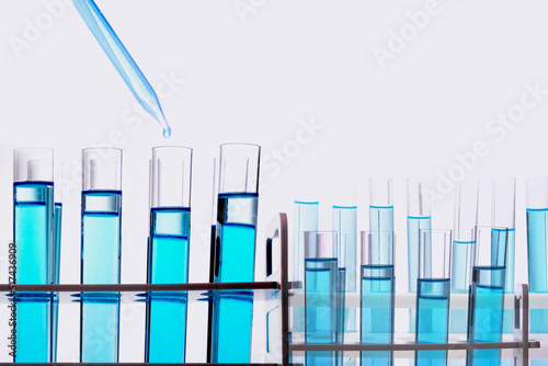 Laboratory research, dropping liquid to test tubes, 