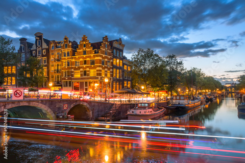 Print op canvas Night Embankment of the Canal in Amsterdam and Light Trails of Cars and Boats