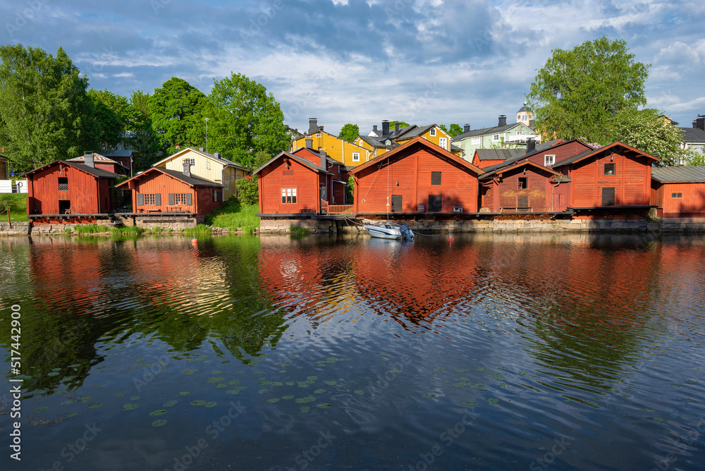 Ancient red barns on the banks of the Porvoоnjoki River on a June afternoon. Symbol of the city of Porvoo, Finland