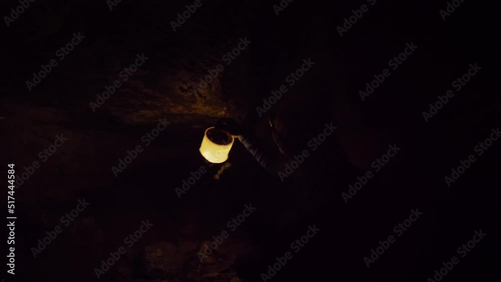Static, person uses warm light to illuminate Luxmore Cave, Kepler Track side trip, New Zealand Static, person uses warm light to illuminate Luxmore Cave, Kepler Track side trip, New Zealand