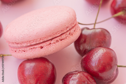 Fototapeta Naklejka Na Ścianę i Meble -  Pink macaron with fresh berries on pink background. Berry dessert
