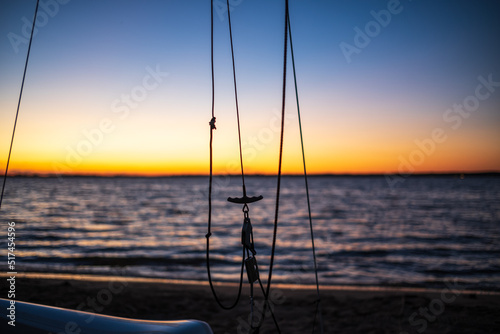 details of a sailboat at sunset