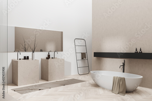 Light bathroom interior with bathtub and washbasins. Mockup empty wall