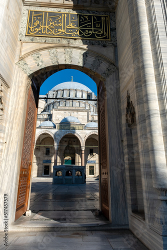 Suleymaniye Mosque entrance with Quran text  old ancient structure  vertical view of mosque gate  Muslim and Islam concept  exterior  Suleymaniye Mosque  Istanbul  Turkey - June 25 2022