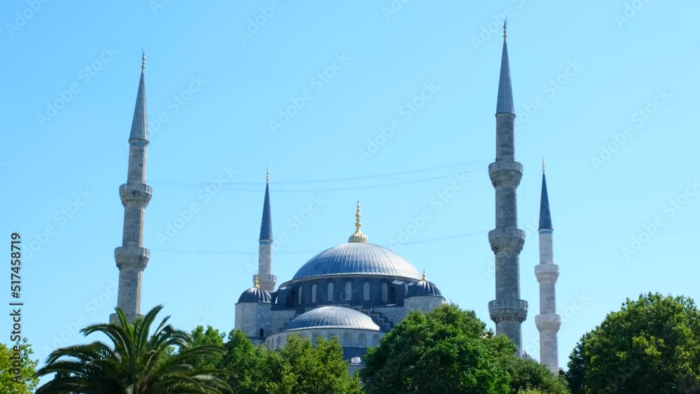 Blue Mosque minarets and dome view with a sunny sky, known as Sultan Ahmet Camii, Muslim and Islam concept, 4k 60 fps video in Istanbul, beautiful landscape with mosque sun and blue sky
