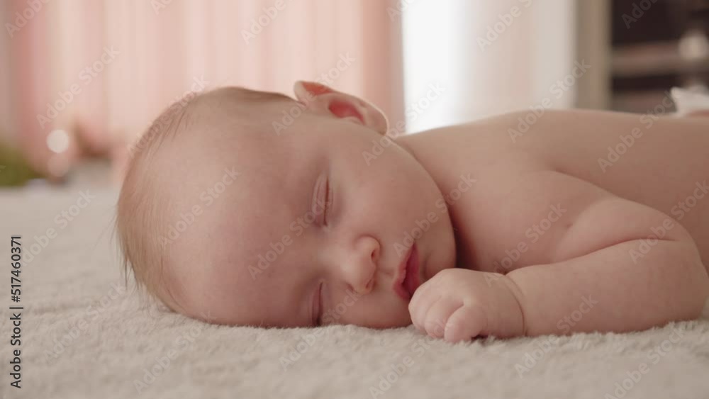 Healthy infant sleeping at home. Beautiful small baby sleeping. Close-up of infant sleeping. Macro shot of a small caucasian baby resting. Shot of napping child, afternoon nap.. Healthy infant sleeping at home. Beautiful small baby sleeping. Close-up of infant sleeping. Macro shot of a small caucasian baby resting. Shot of napping child, afternoon nap..