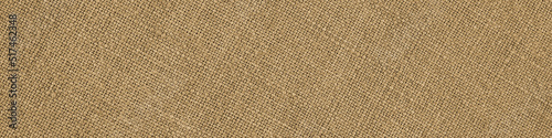 Light brown woven surface close up. Linen textile texture. Fabric handicraft glamorous banner. Textured braided home header. Macro