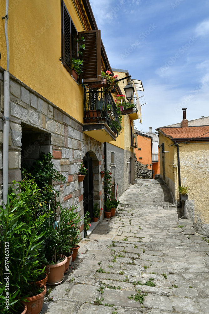 A narrow street between the old houses of Albano di Lucania, a village in the Basilicata region, Italy.	