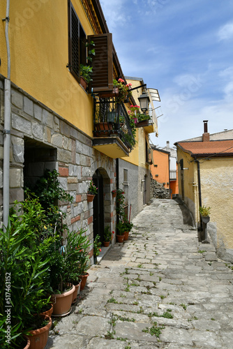 A narrow street between the old houses of Albano di Lucania, a village in the Basilicata region, Italy. 