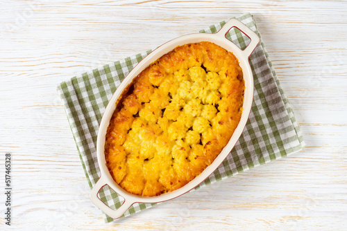 Shepherd's pie or Cottage pie. Minced meat, mashed potatoes and vegetables casserole on white wooden background. Traditonal British, United Kingdom, Ireland cuisine. Top view, flat lay