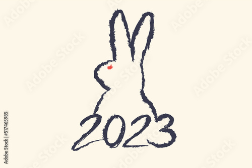 Vector caligraphy of 2023 and bunny like symbol new year. New year 2023. Hand drawing lettering with rabbit