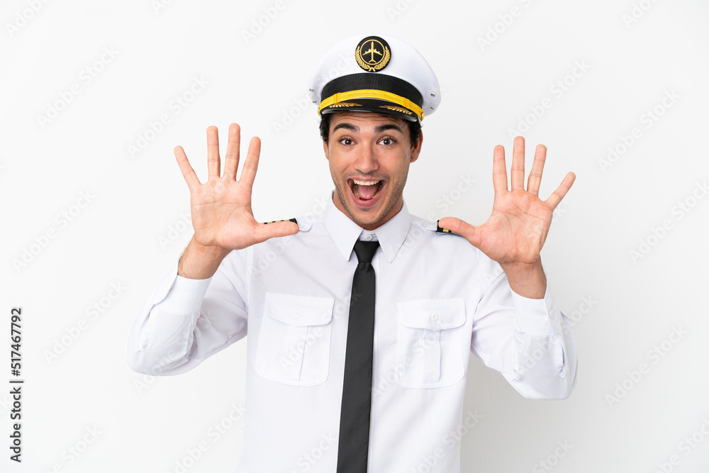 Airplane pilot over isolated white background counting ten with fingers Airplane pilot over isolated white background counting ten with fingers