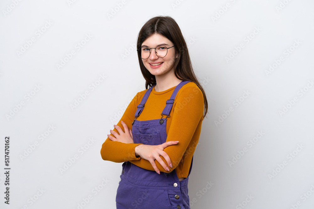 Young Russian woman isolated on blue background with arms crossed and looking forward Young Russian woman isolated on blue background with arms crossed and looking forward
