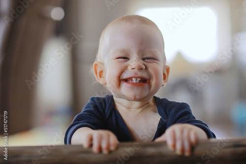 small child is laughing smiling a cheerful kid