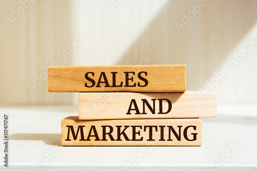 Wooden blocks with words 'SALES AND MARKETING'.