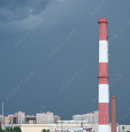 pipes of thermal power plant, industrial plant in a city. ecology and environmental pollution