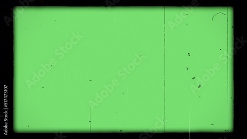Old film look animation on green color. Film noise, flicker, scratches, dust, hair, light leaks and shake effects included. 4K. Retro film video footage. Chroma key.
