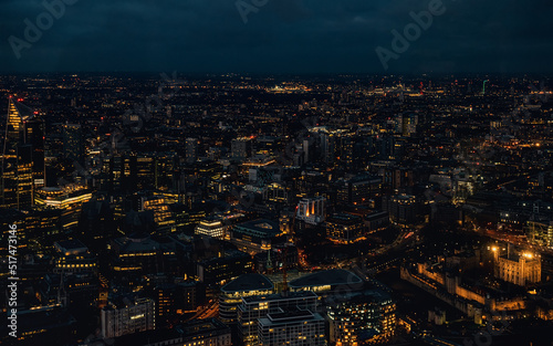 Aerial view of north east London, just after dark, orange yellow street lights starting to glow © Lubo Ivanko