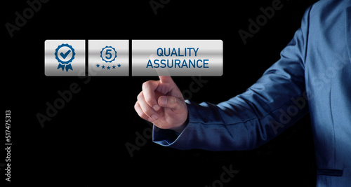 Quality Assurance Concept. Business people show high quality assurance mark, good service, premium, five stars, premium service assurance, excellence service, high quality, business excellence.