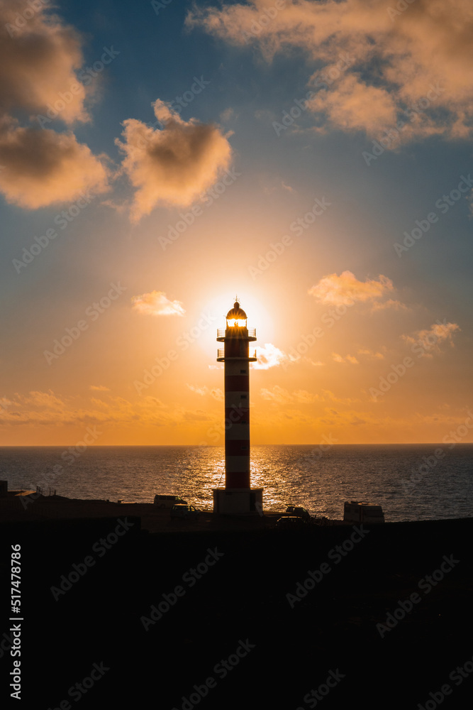 Vertical photo of a sunset at the Faro de Sardina, Galdar, on the island of Gran Canaria