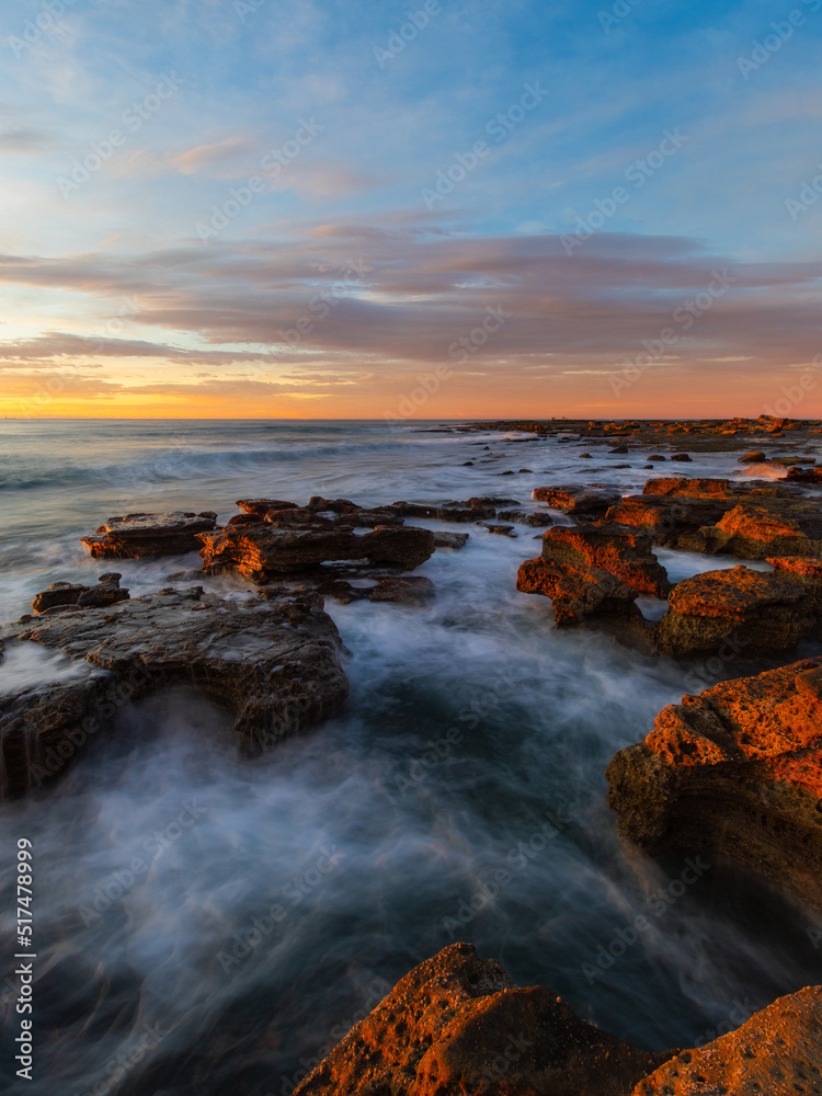 Sunrise view at the rocky beach coastline. Sunrise view at the rocky beach coastline.