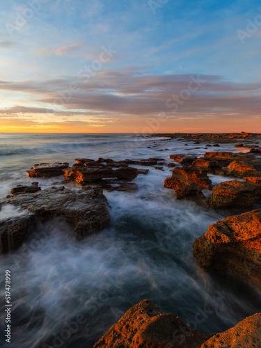 Sunrise view at the rocky beach coastline. © AlexandraDaryl