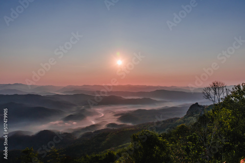  The view from the mountain with the morning sunrise, beautiful, with a thin mist on the ground with the color of the sky being twilight.