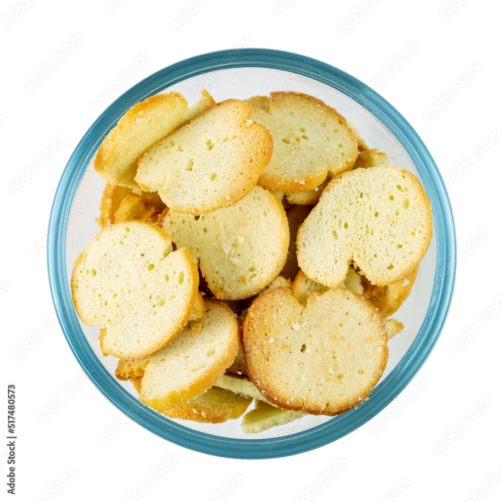 Crackers bruschetta with spices in glass bowl isolated on white background. Top view. Crackers bruschetta with spices in glass bowl isolated on white background. Top view.