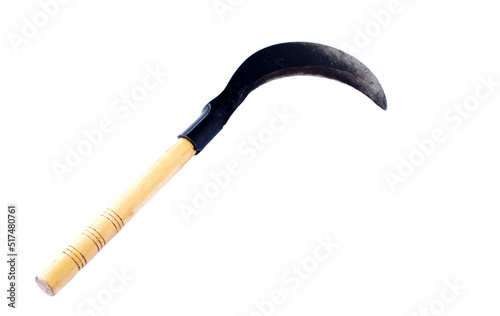 Vintage sickle with wooden handle isolated on white background. Concept : Agricultural tool, use for getting rid of grass or weeds in paddy field or gardens, use for harvesting rice or other purposes. photo