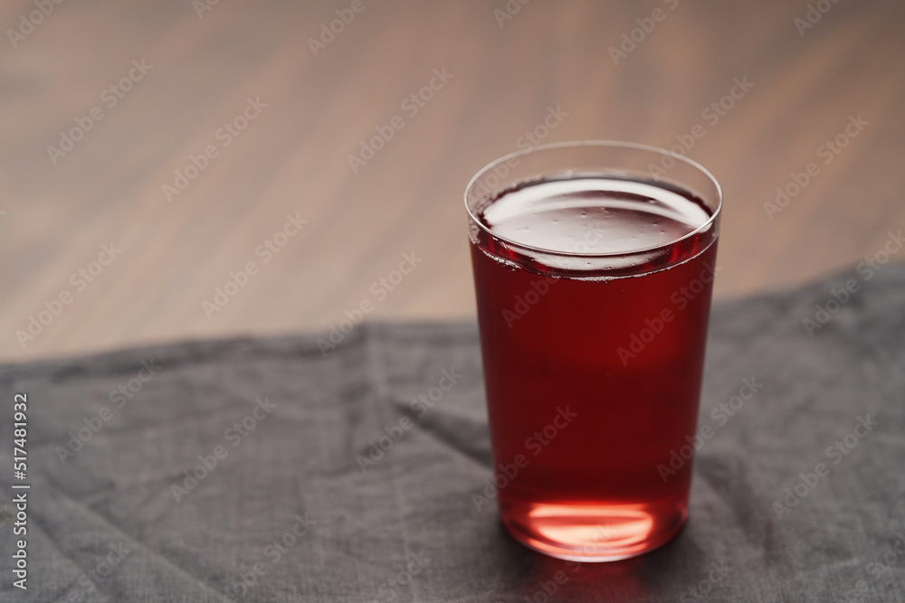 berry drink in thin glass on wood table with copy space berry drink in thin glass on wood table with copy space