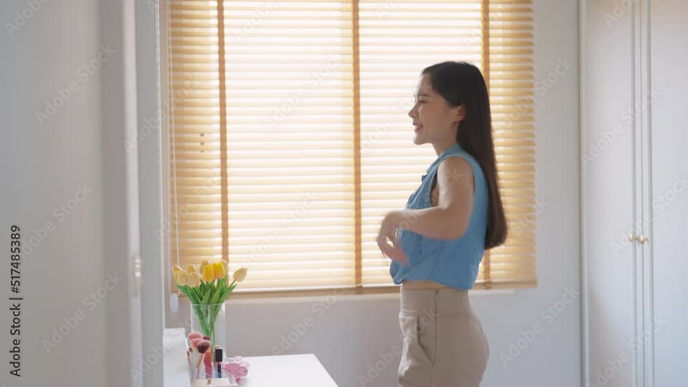 Young girl self cheer up smile in front of mirror look at post it quote sticky note paper. Closeup woman asia Gen Z inhale breath mental health care pep talk at home stress relief relax life success. Young girl self cheer up smile in front of mirror look at post it quote sticky note paper. Closeup woman asia Gen Z inhale breath mental health care pep talk at home stress relief relax life success.