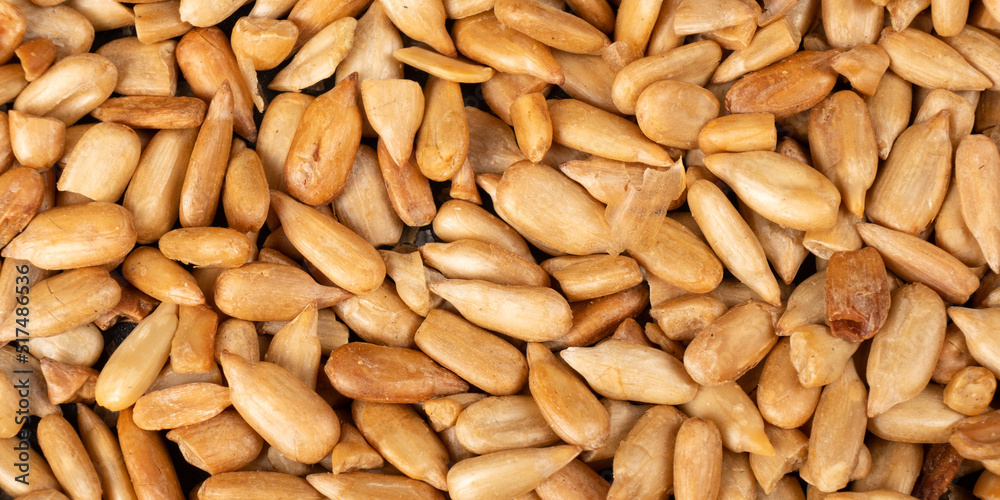 peeled sunflower seeds background texture macro . peeled sunflower seeds background texture macro .