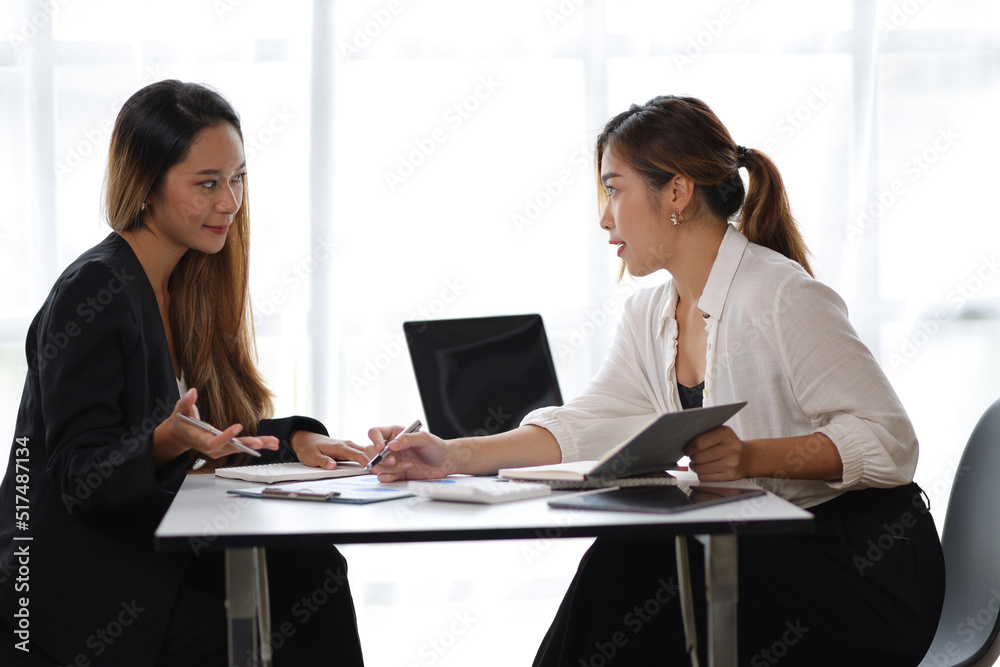 Businesswomen and colleagues discussing and discussing work on business projects together. Female manager in office discussing and interviewing job applicant for new employees. Businesswomen and colleagues discussing and discussing work on business projects together. Female manager in office discussing and interviewing job applicant for new employees.