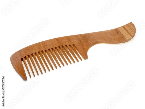 Wooden hair comb isolated on white background