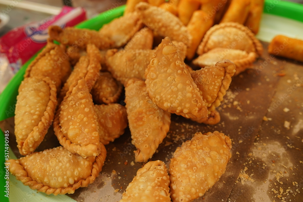 Pastel goreng, a snack containing meat and vegetables cooked by frying. It has a crunchy and savory texture. pastels are easy to find in Indonesian traditional markets Pastel goreng, a snack containing meat and vegetables cooked by frying. It has a crunchy and savory texture. pastels are easy to find in Indonesian traditional markets