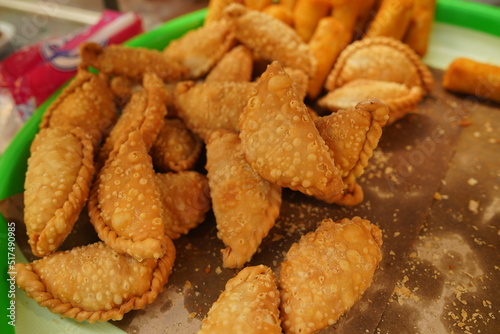 Pastel goreng, a snack containing meat and vegetables cooked by frying. It has a crunchy and savory texture. pastels are easy to find in Indonesian traditional markets