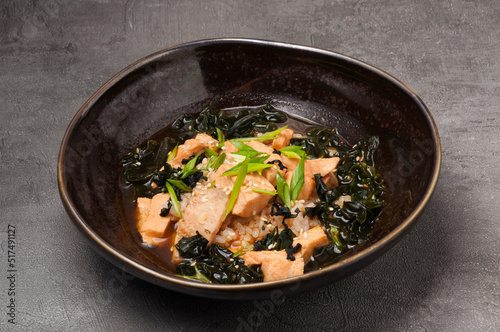traditional Japanese cuisine: miso soup with salmon, seaweed and rice