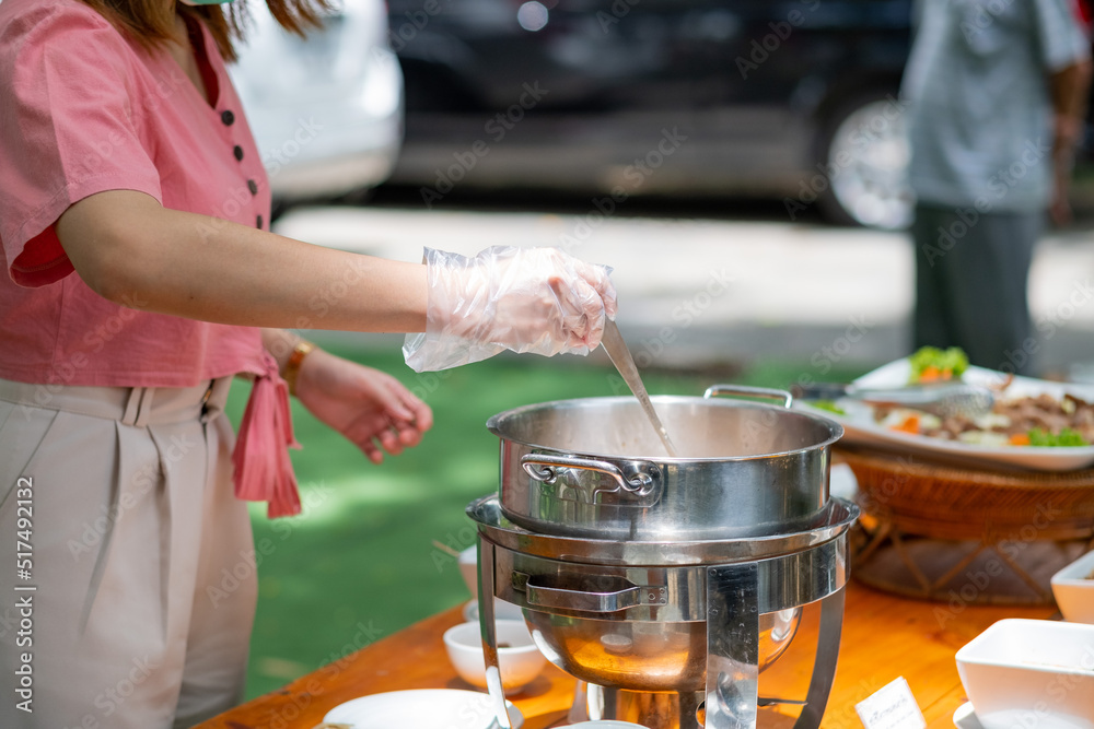 scooping the food, catering, dinner time scooping the food, catering, dinner time
