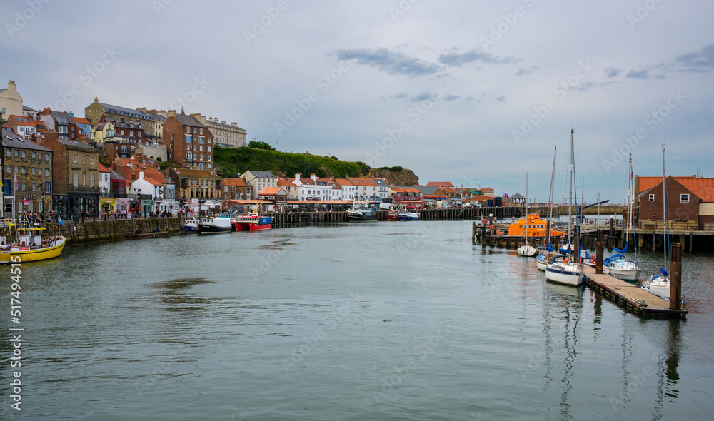 A view of Whitby harbour looking towards the harbour entrance from the swing bridge