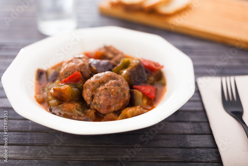 steamed meatballs with stewed vegetables on plate