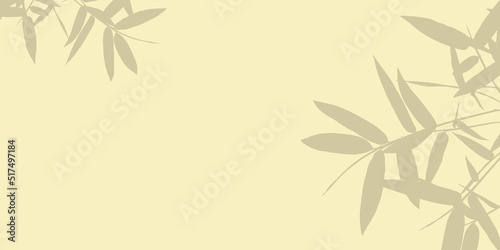 Shadow of bamboo leaves is placed on light backdrop and copy space.