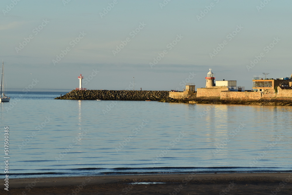 A lighthouse, the sea in the clase of Howth, in Ireland